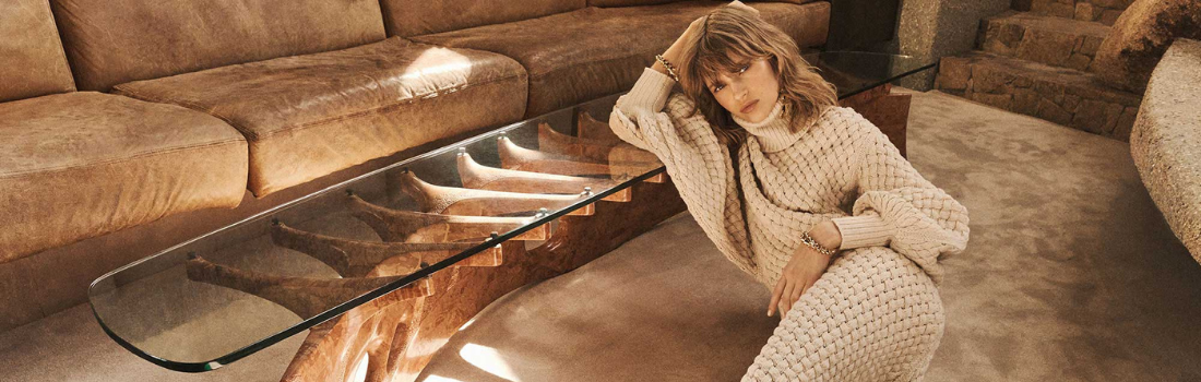A woman is wearing knitwear